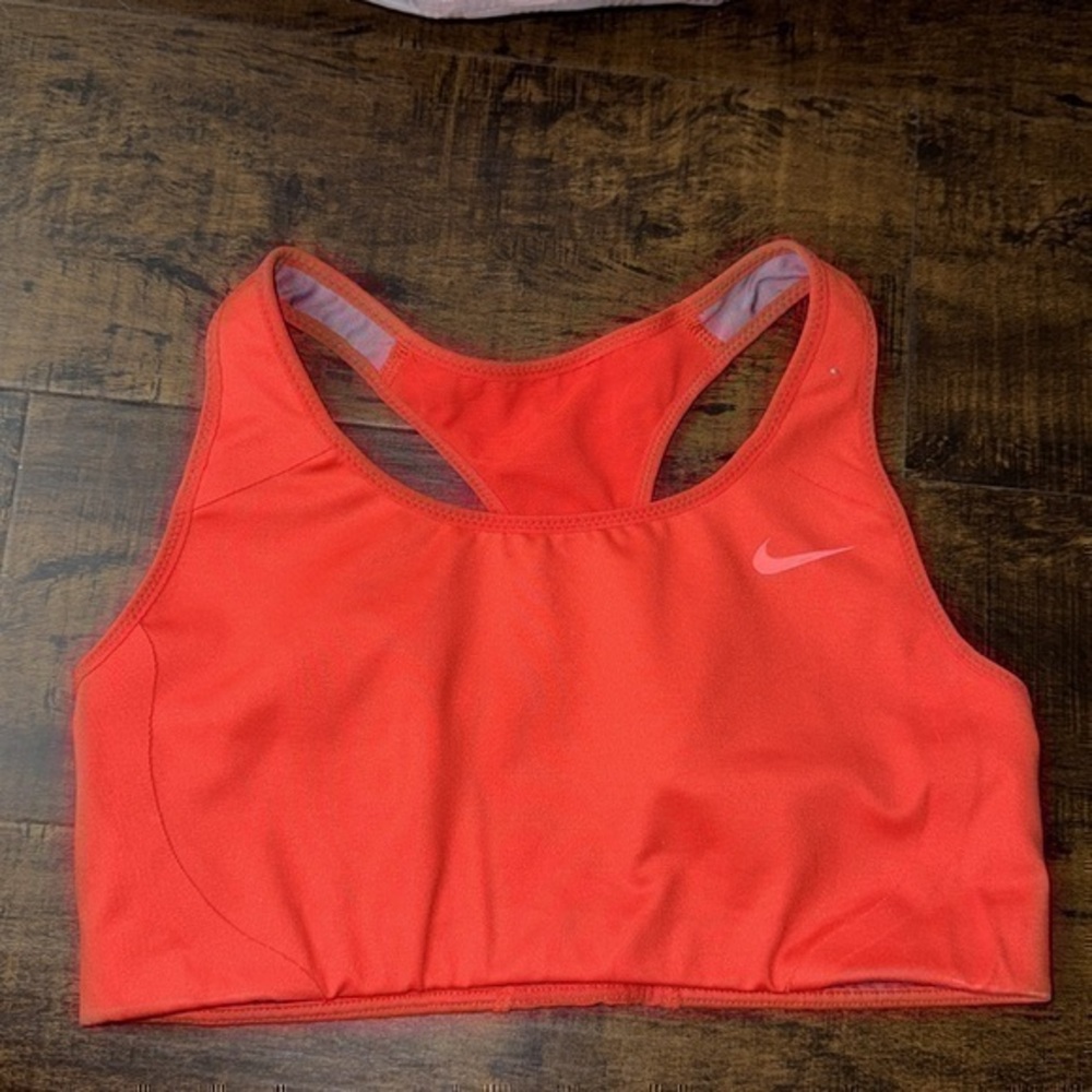 UEC orange with pink swoosh moderate impact sports bra size small